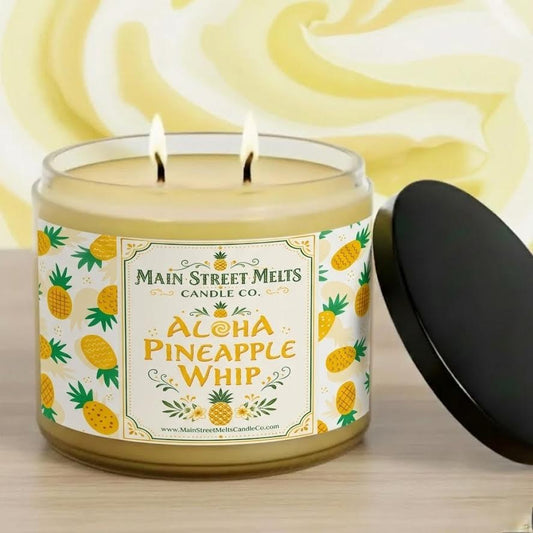 Candle labeled 'Aloha Pineapple Whip' from Main Street Melts Candle Co. with a pineapple pattern on the label.
