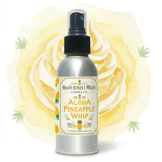 A bottle of 'Aloha Pineapple Whip' fragrance spray with a pineapple-themed label on a white background.